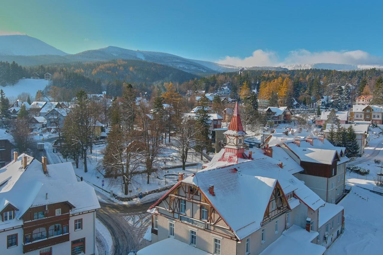 Winterpol White Jar Karpacz in Poland - a snow covered town with mountains in the background.