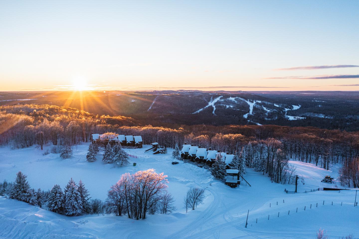 Black River Basin in USA - the sun is setting over a snowy landscape.