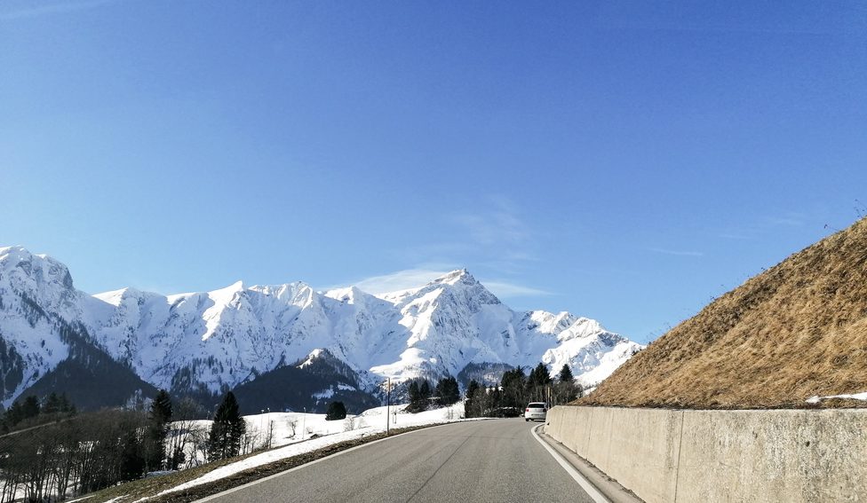 Swiss chalet in Tschappina, Graubünden, nestled amidst a beautiful winter landscape with mountains in the background and a serene, snowy scene.