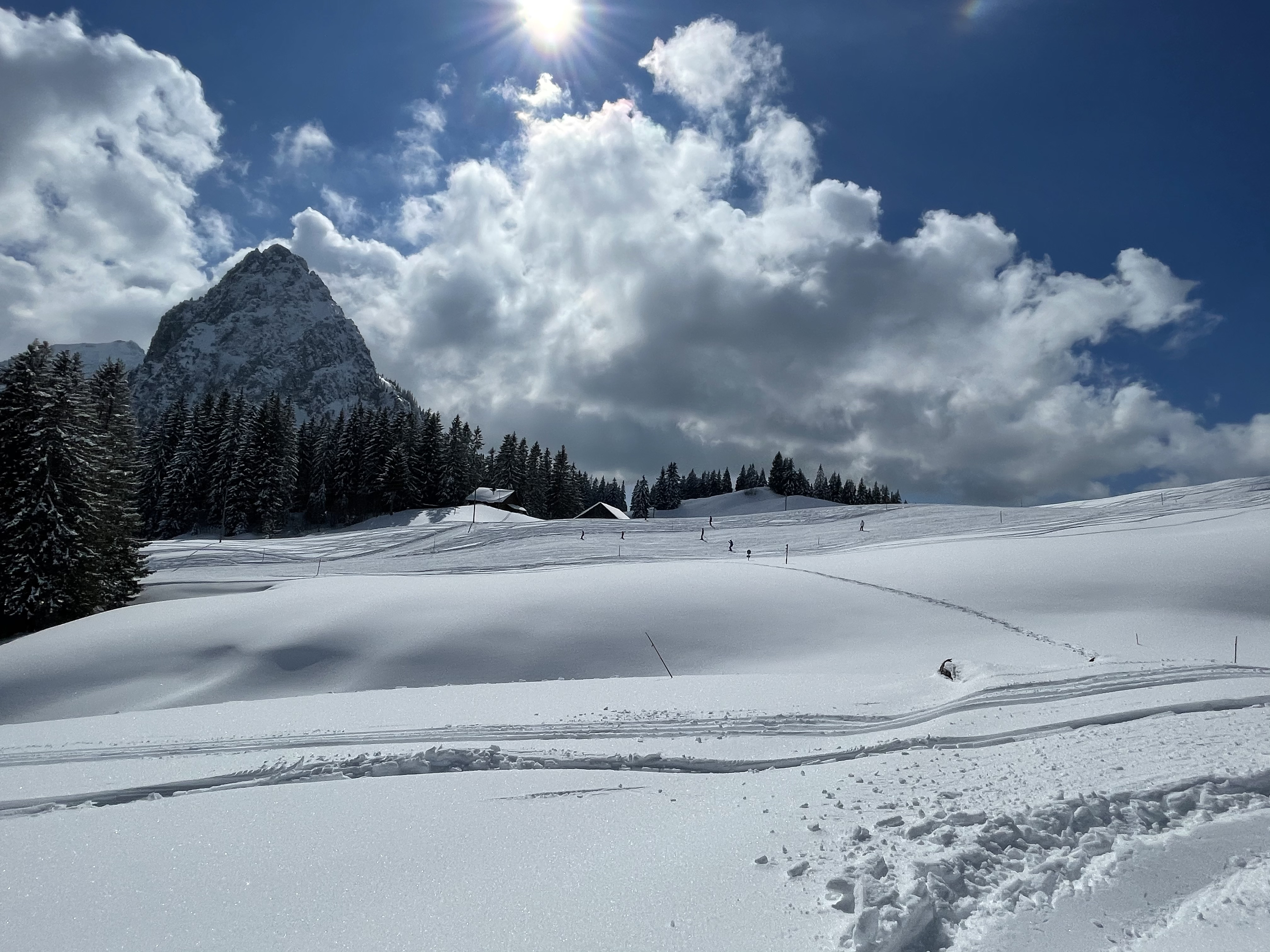Winter sports enthusiasts enjoying the stunning, snow-covered slopes at Brunni-Bahnen, Engelberg-Titlis in Central Switzerland, surrounded by majestic snowy mountains.