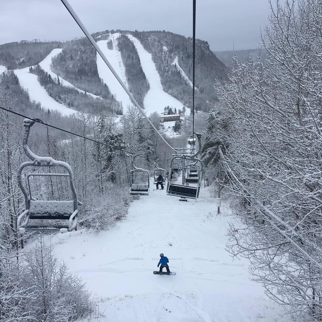 Loch Lomond in Canada - a person on a snowboard going down a hill.