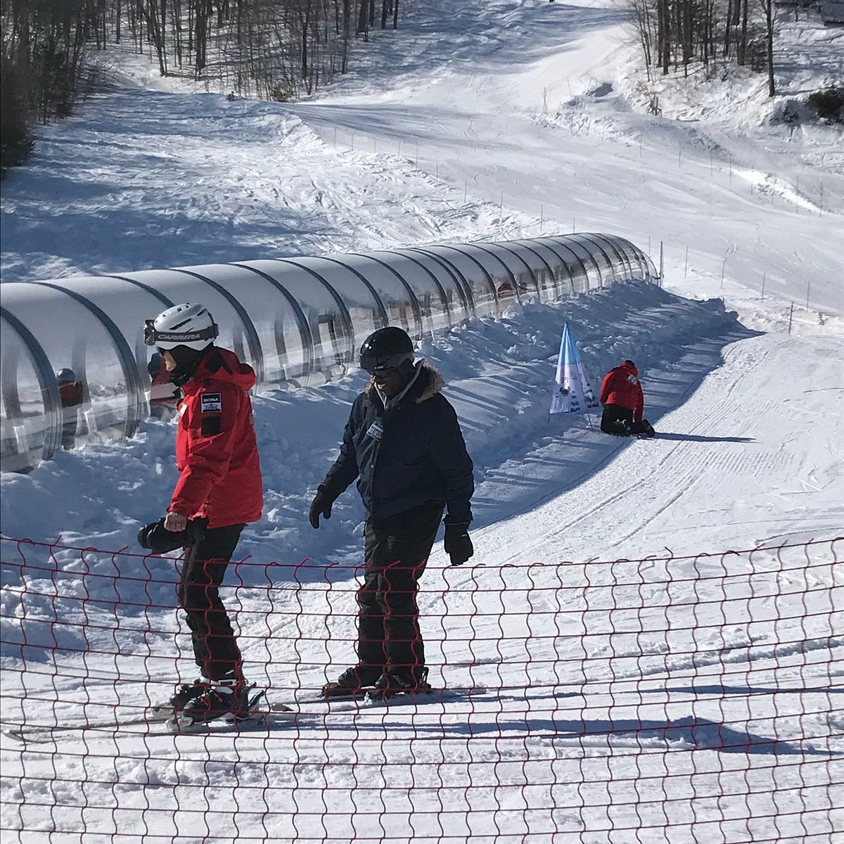 Montcalm in Canada - a group of people riding snowboards on a snowy slope.