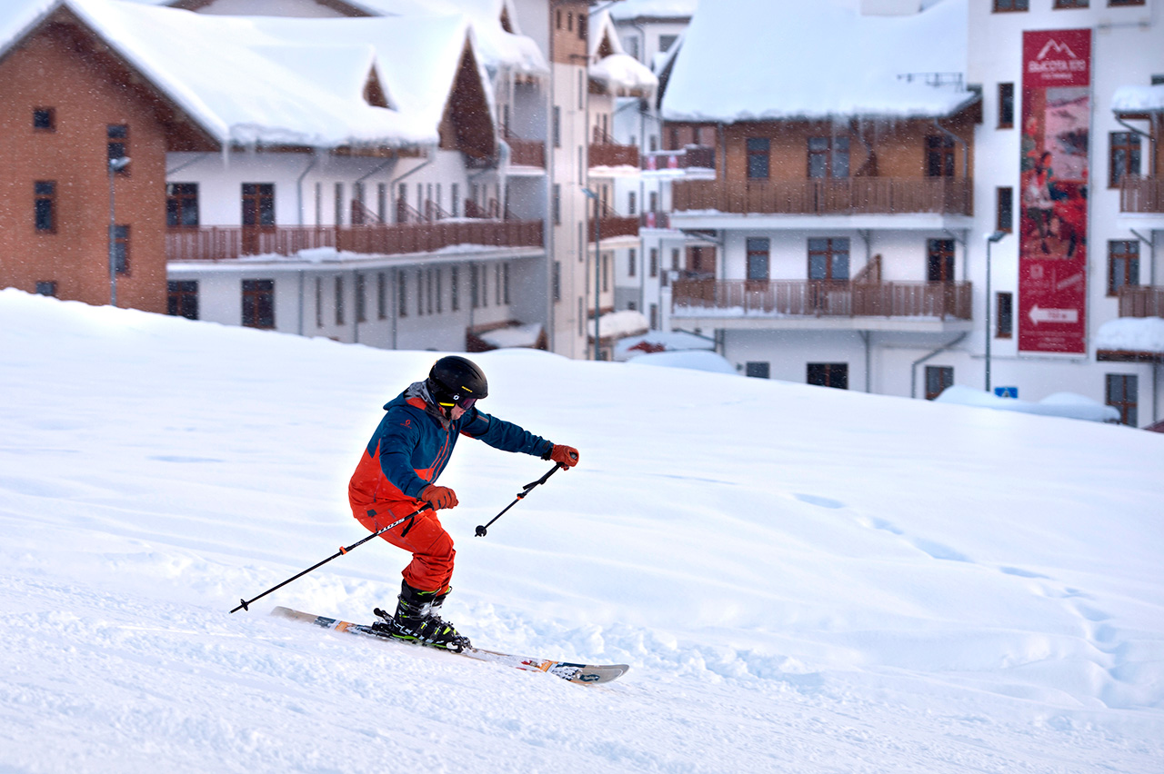 Abzakovo in Russia - a person skiing down a hill in the snow.