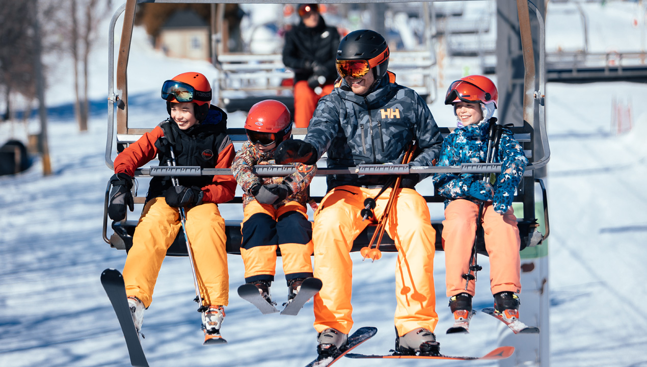 Ski Saint-Bruno in Canada - a group of people sitting on a ski lift.