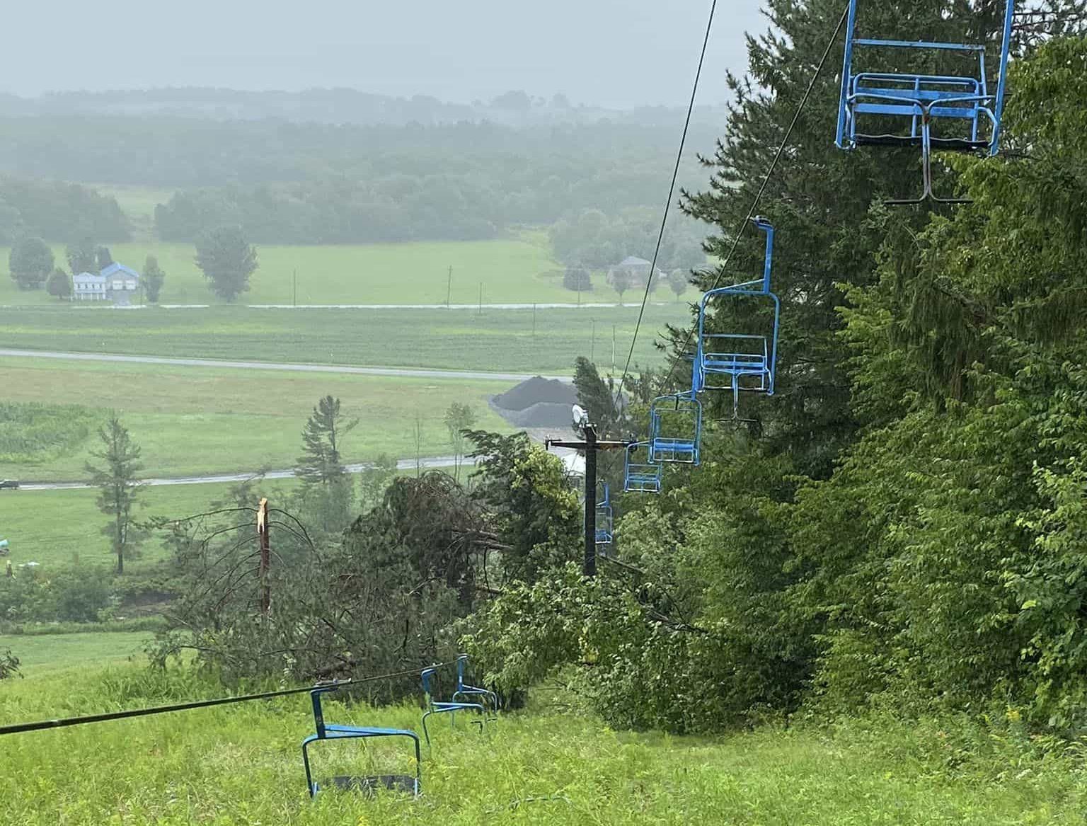 Snow Ridge in USA - a blue chair sitting in the middle of a field.
