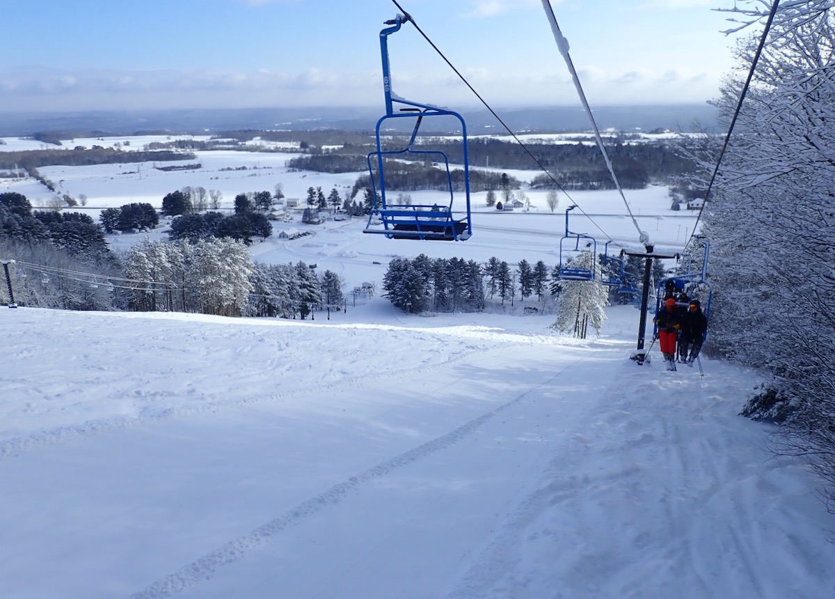 Snow Ridge in USA - a ski lift going up a snowy hill.