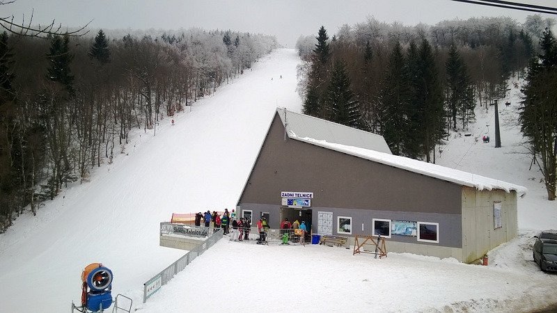 Winter view of Telnice sports centre in Ústí nad Labem Region, Czech Republic, showcasing a popular ski resort bustling with activity.