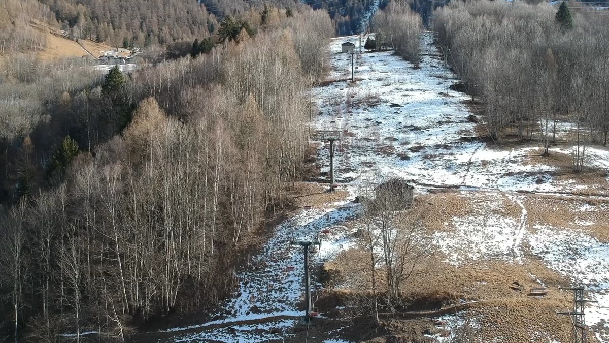 Monesi di Triora in Italy - an aerial view of a river in the mountains.