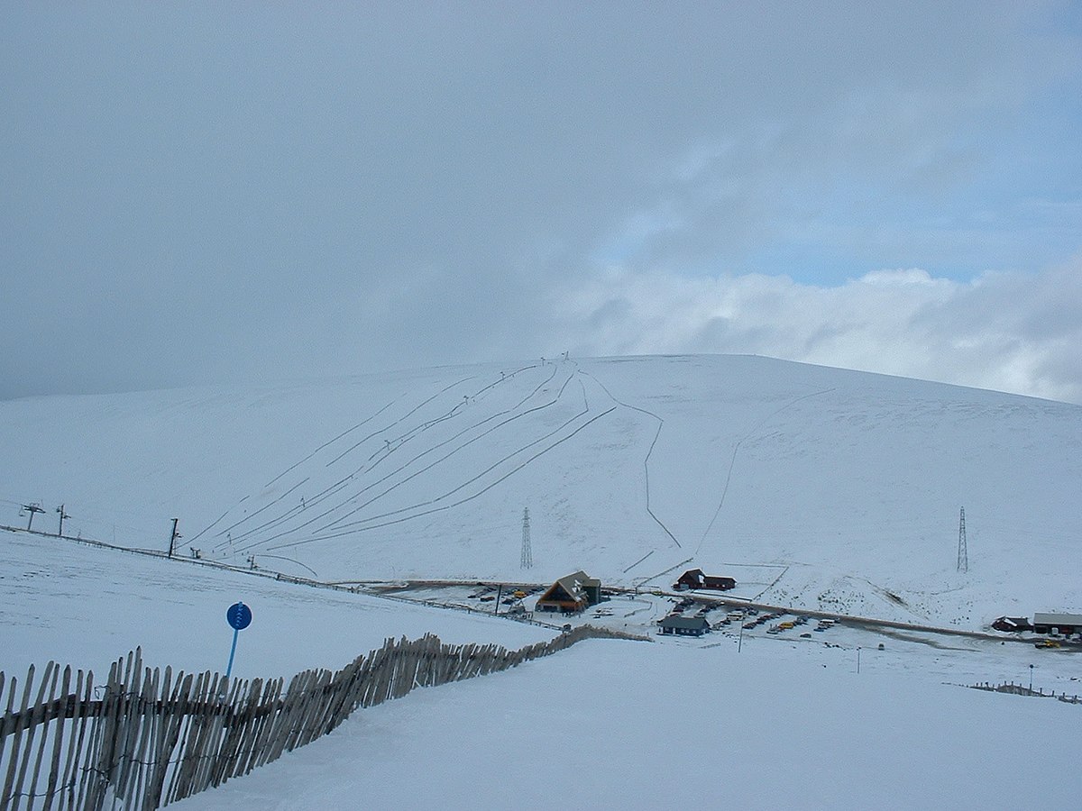 Lecht Ski Centre in United Kingdom - a snow covered hill with a wooden fence.