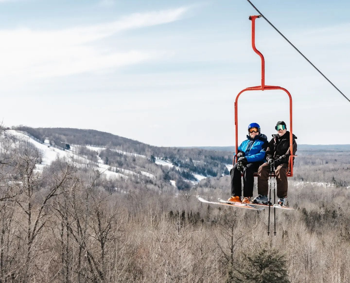 Porcupine Mountain in USA - a person on a ski lift in the mountains.