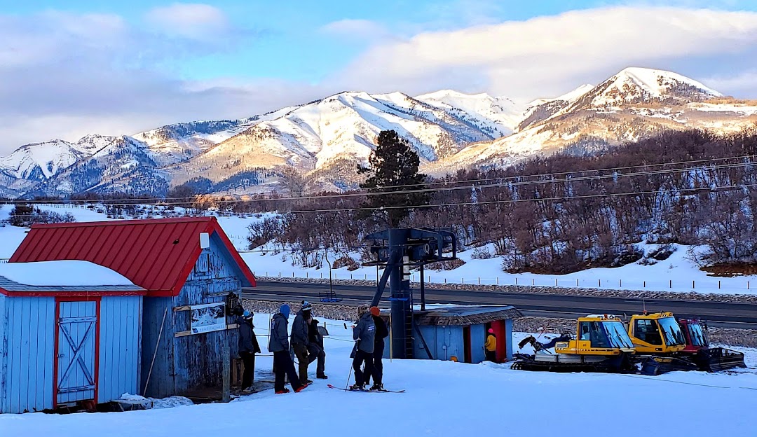 Winter panorama at Hesperus Ski Area, Colorado, USA. Awesome winter scenery on display with skiers enjoying the pristine slopes and the ski lift nearby aiding their ascent.