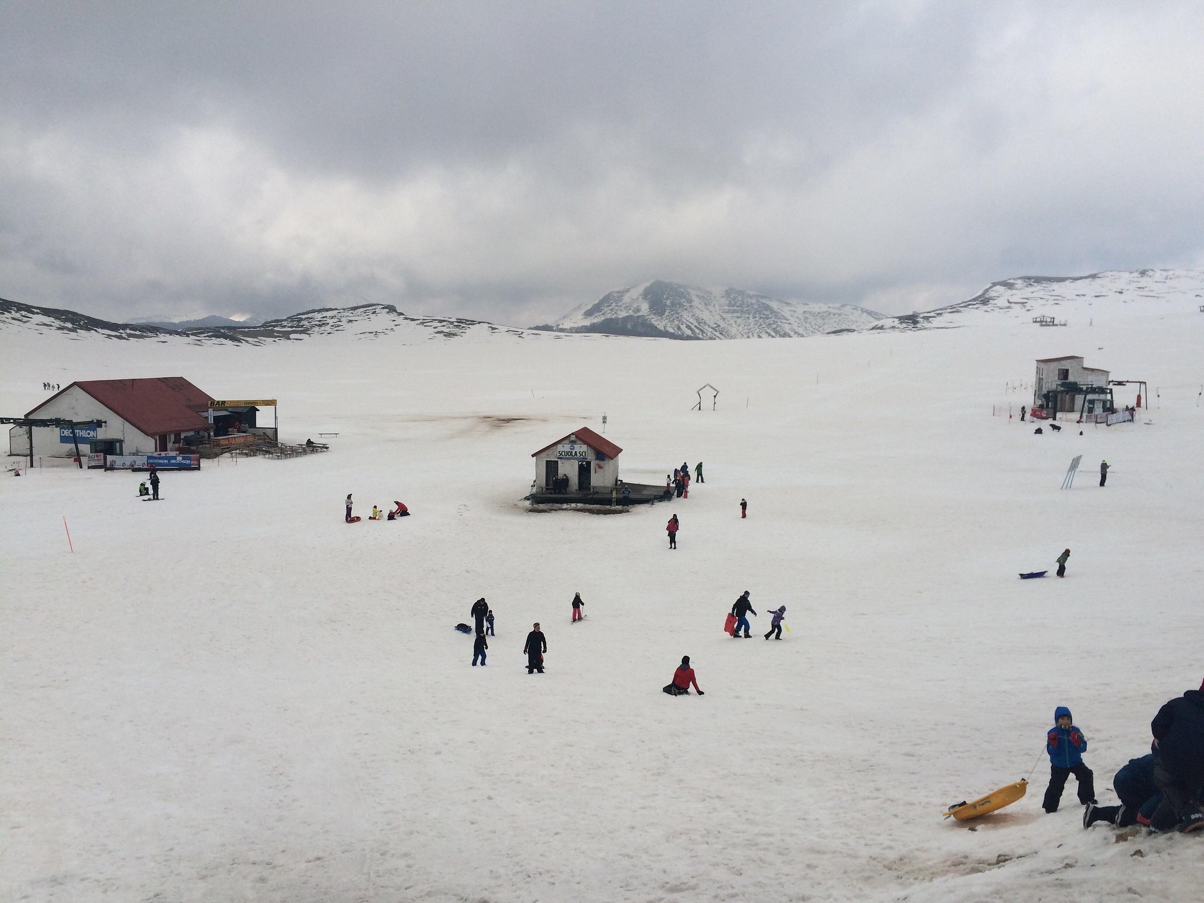 Winter scene at Campocatino ski resort in Frosinone, Italy, featuring stunning snow-covered scenery, slopes for winter sports, and a cosy chalet.
