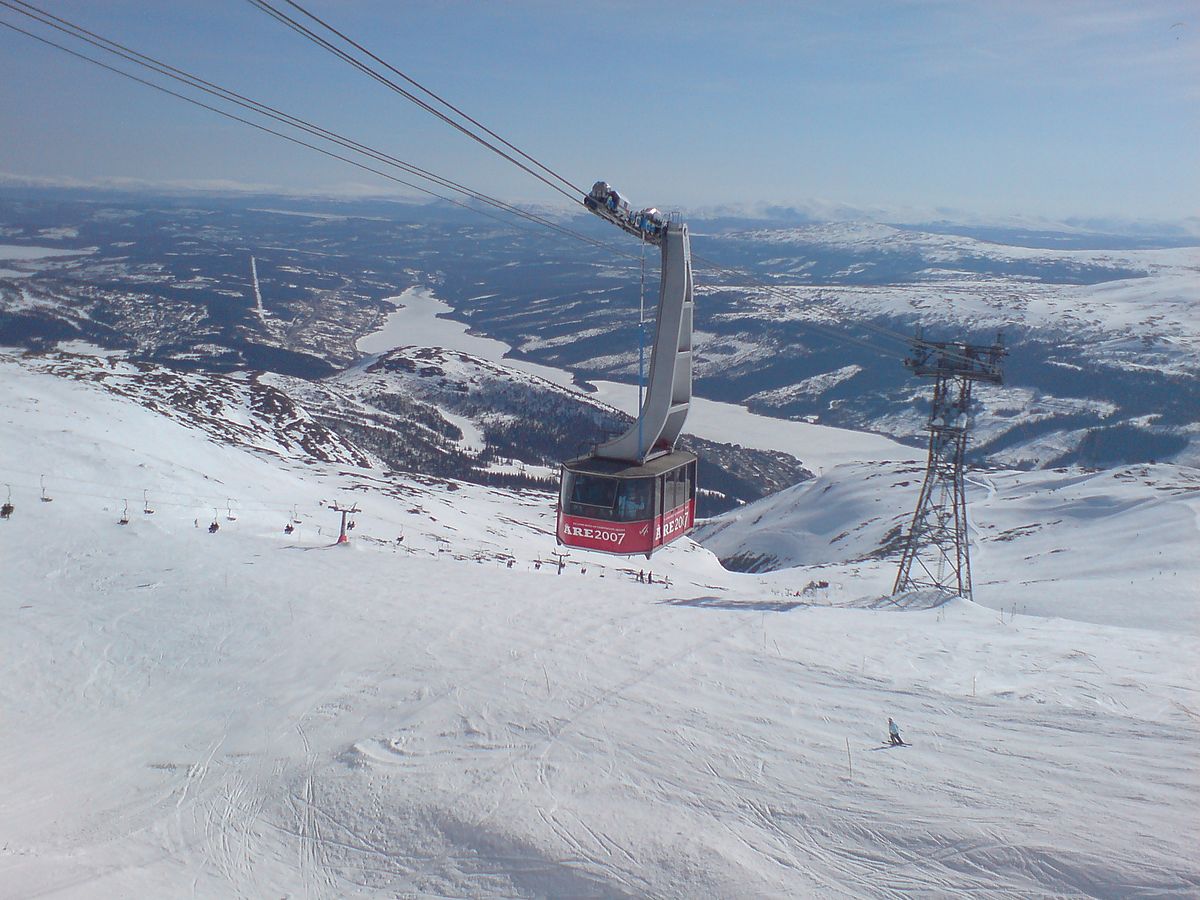 Åre in Sweden - a ski lift going up a snowy mountain.
