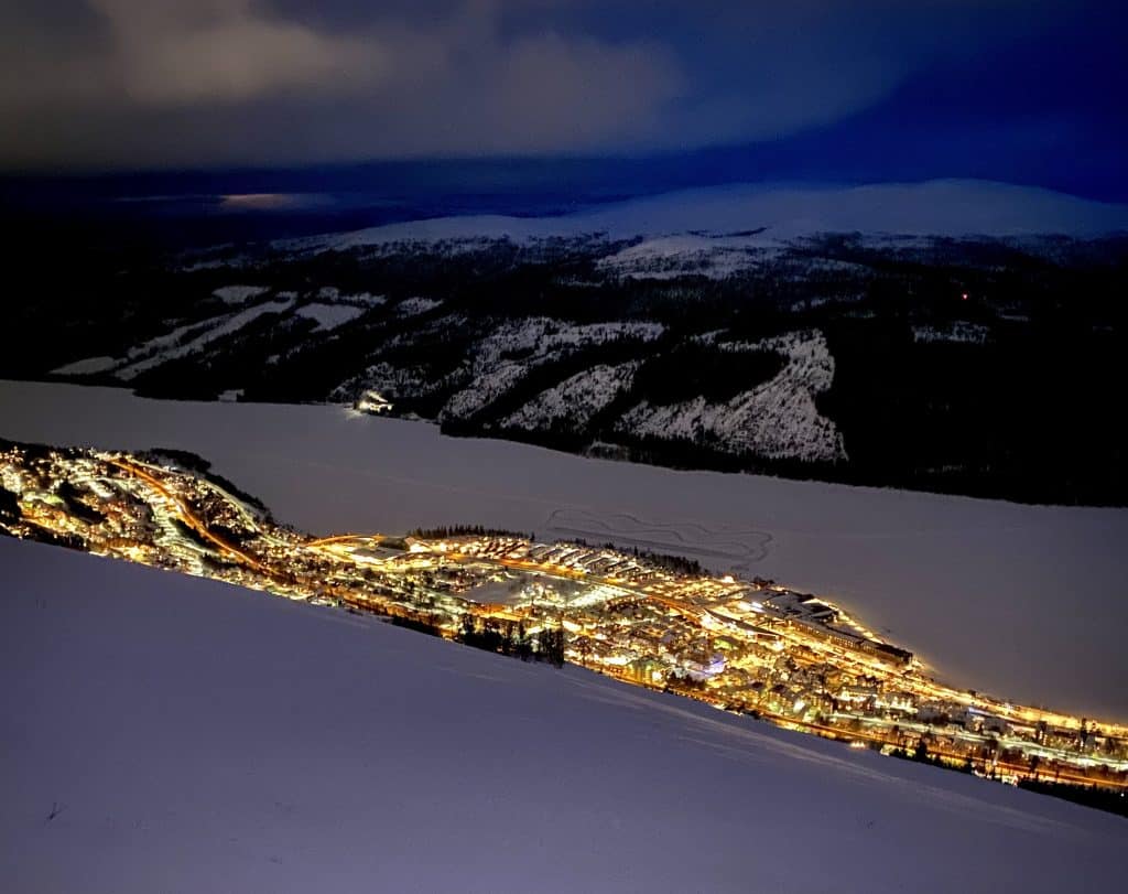 Åre in Sweden - a city lit up at night in the snow.
