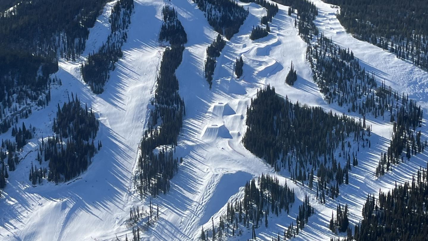 Mount Sima in Canada - a large mountain covered in snow and trees.