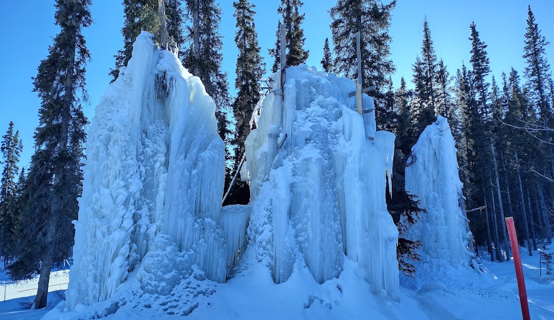 Stunning view of the winter scenery at Mount Sima in Whitehorse, Yukon, Canada. The scene captures a lively winter sports scene at a ski resort bustling with winter enthusiasts.