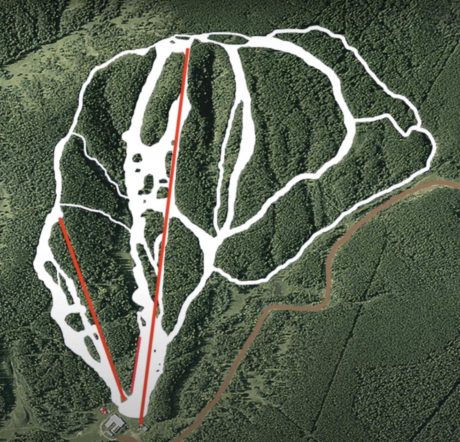A skier races down a slope at Silver Summit a ski resort in Alberta Canada. A mountain and ski lift loom in the background of this picturesque winter scene.