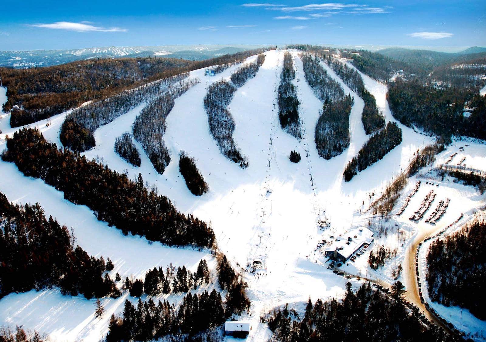 Mont Avalanche in Canada - a ski slope covered in snow and surrounded by trees.
