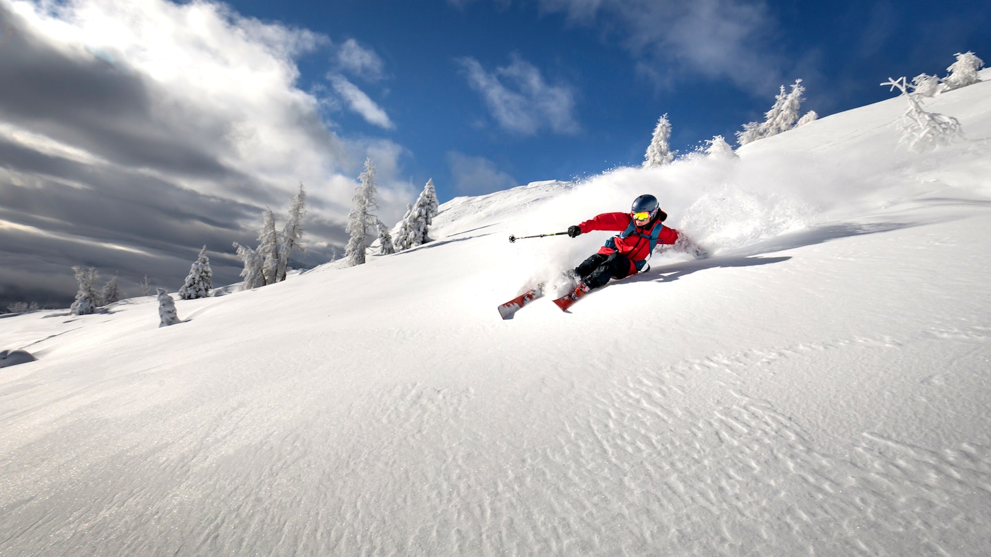 Fjätervålen in Sweden - a person riding a snowboard down a snowy slope.