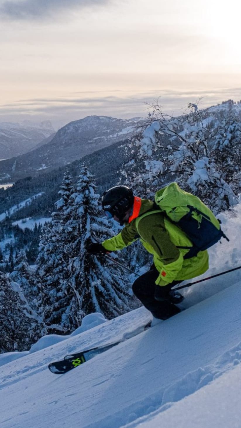 Sogn Skisenter in Norway - a man riding a snowboard down a snowy slope.