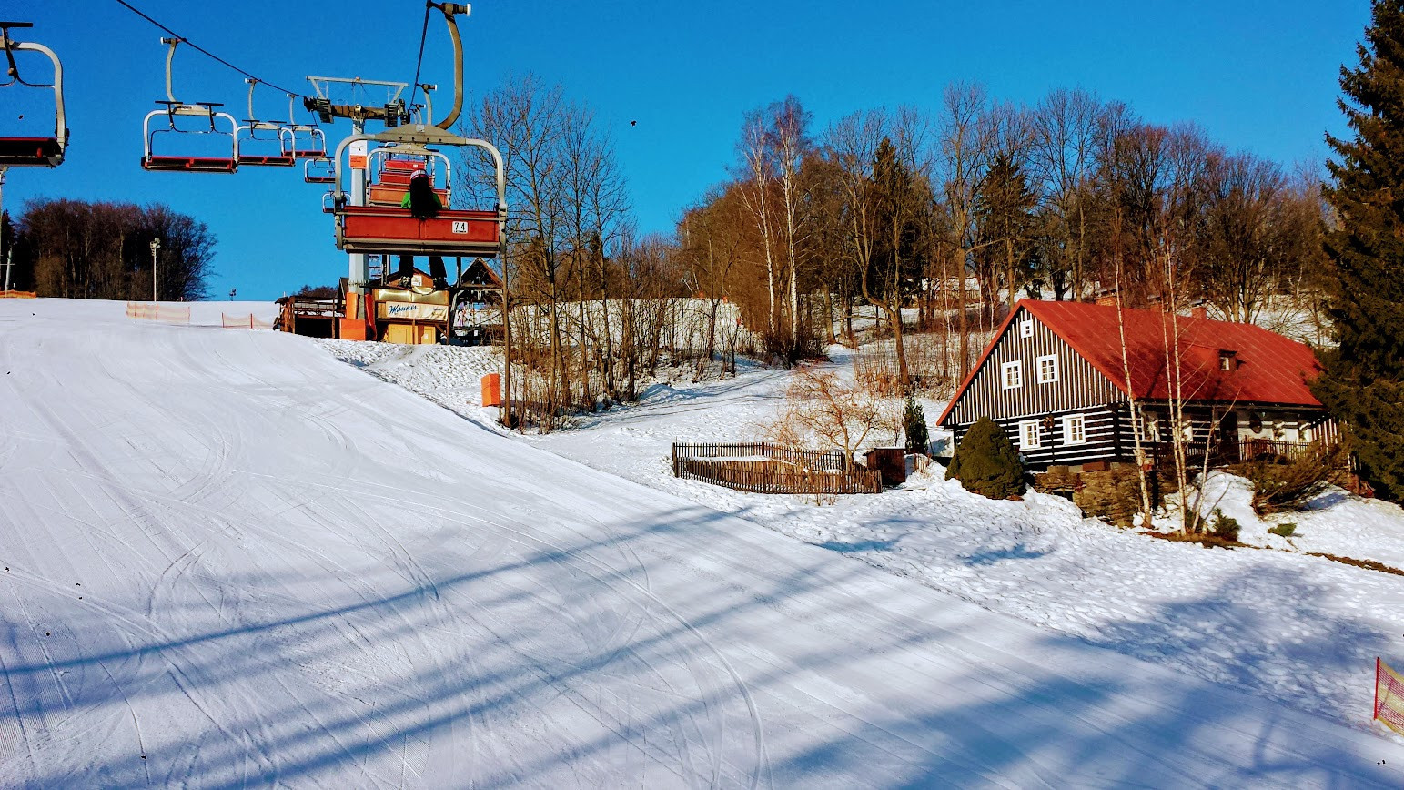 Herlíkovice-Bubákov in Czech Republic - a ski lift going up a snowy hill.