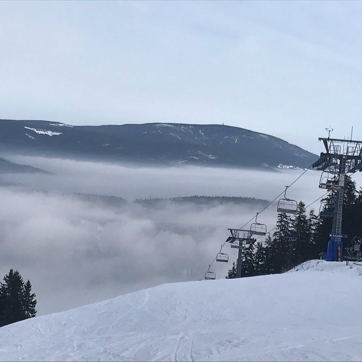 Herlíkovice-Bubákov in Czech Republic - a ski lift going up a snowy hill.
