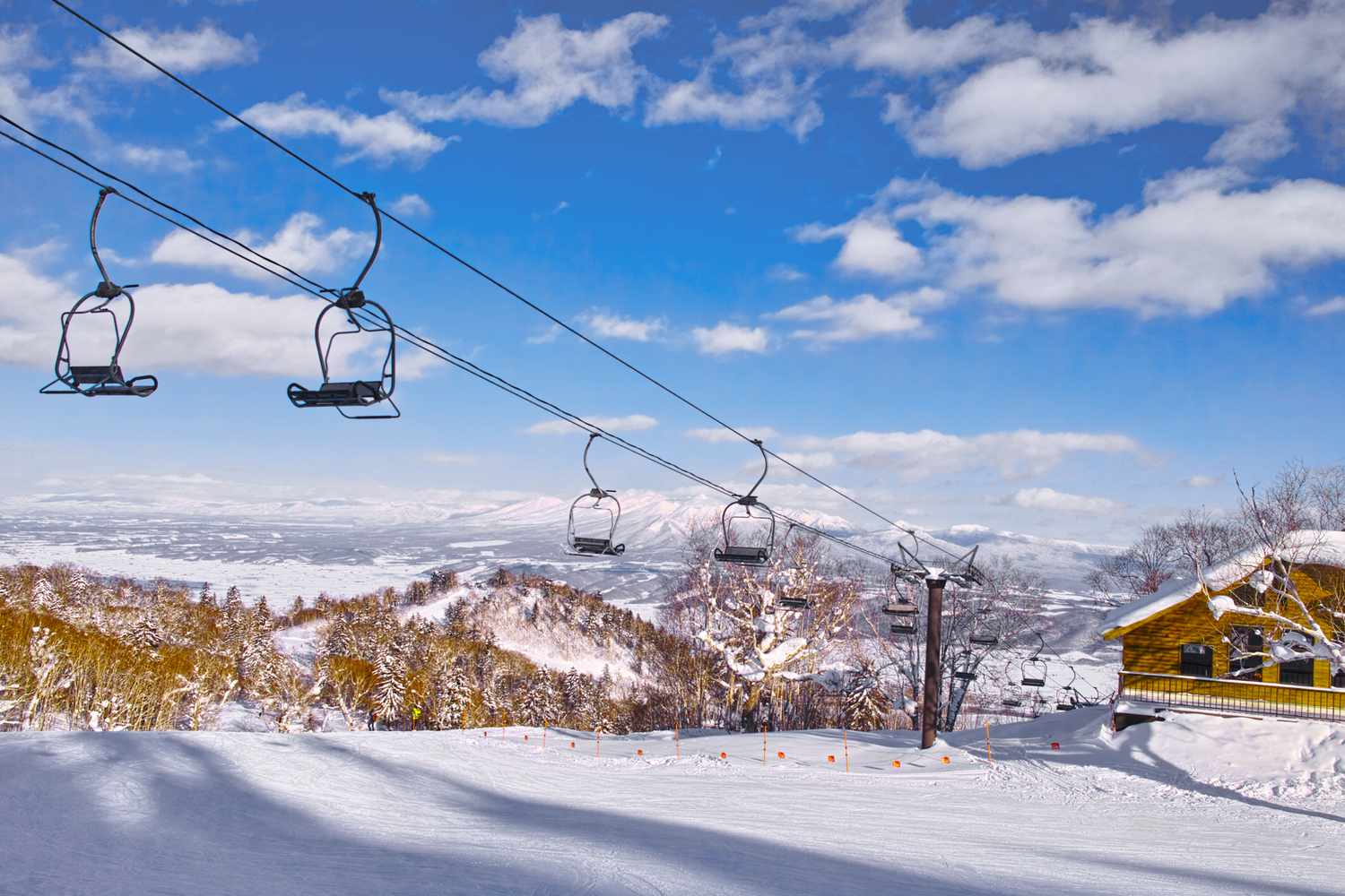 Sun Valley Resort in Japan - a ski lift going up a snowy slope.