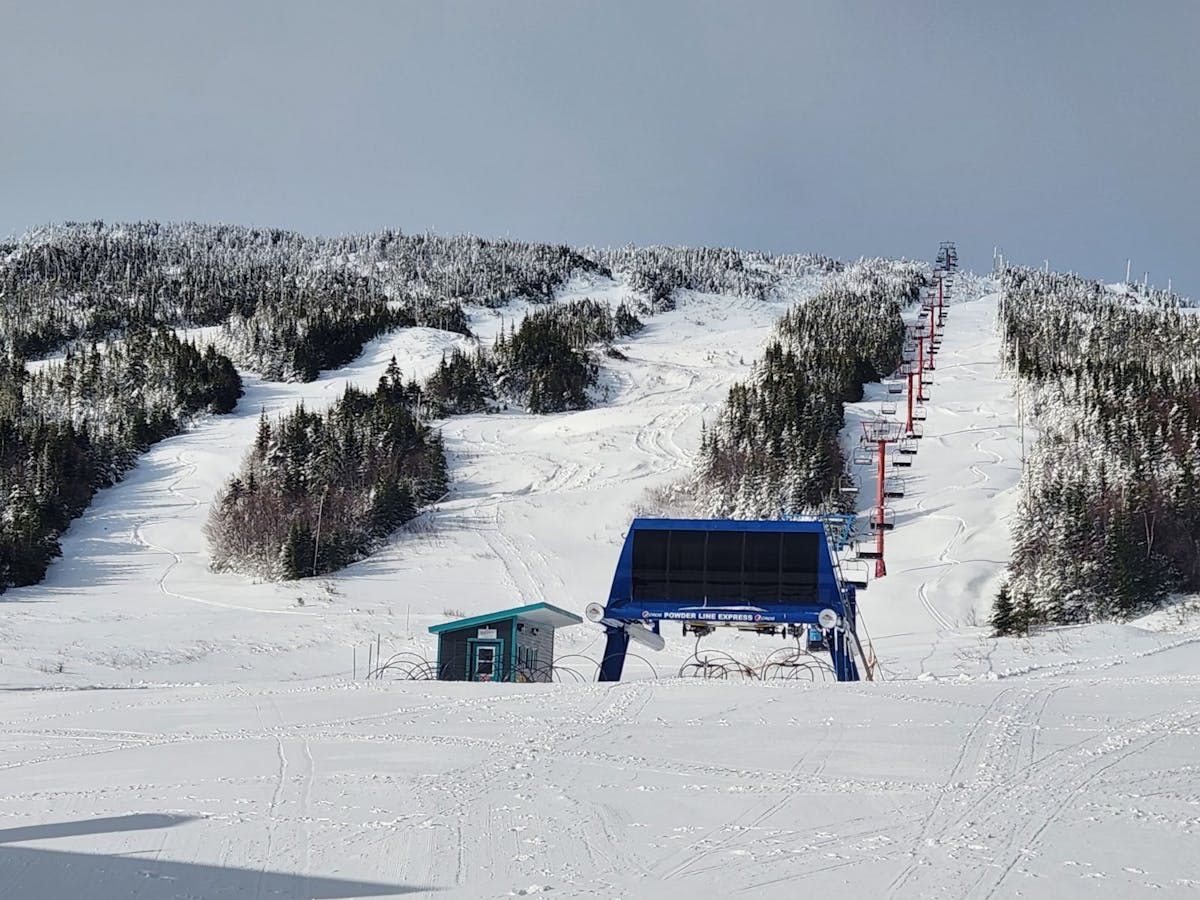 White Hills in Canada - a ski slope covered in snow with a ski lift.