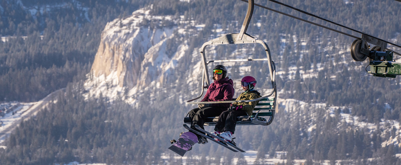 Fairmont Hot Springs in Canada - a person riding a ski lift in the air.