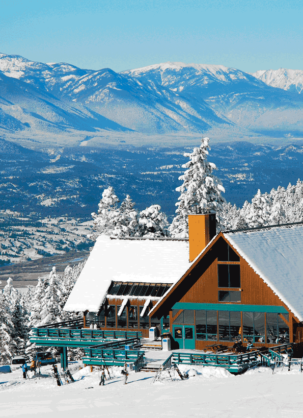 Winter scene at Fairmont Hot Springs in the Kootenay Rockies, British Columbia. A bustling ski resort amid breathtaking winter scenery, offering a myriad of winter sports activities.