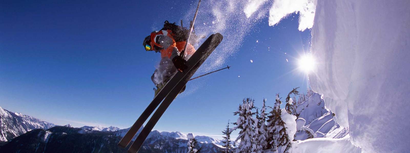 Fairmont Hot Springs in Canada - a person jumping in the air on skis.