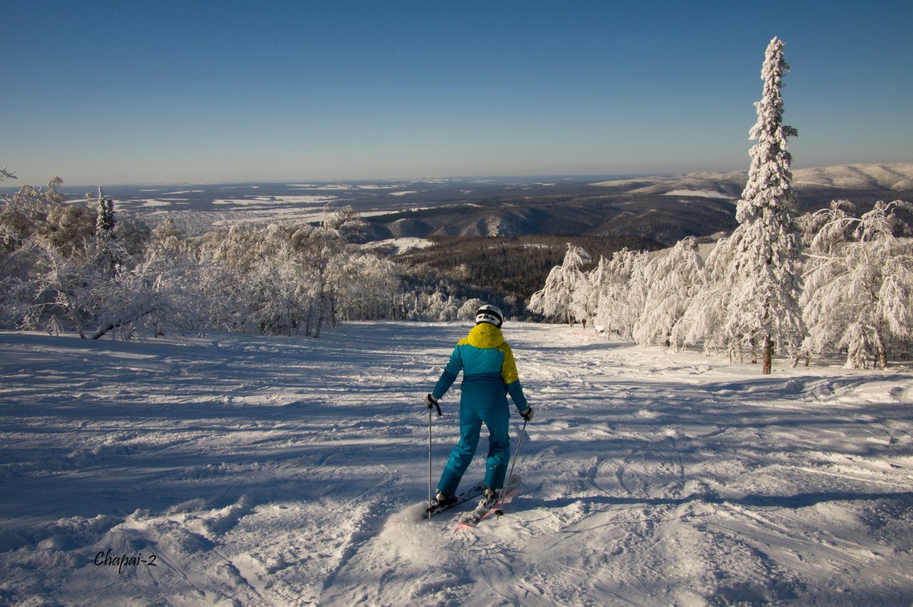 Adzhigardak in Ural Federal District - a person on skis in the snow.