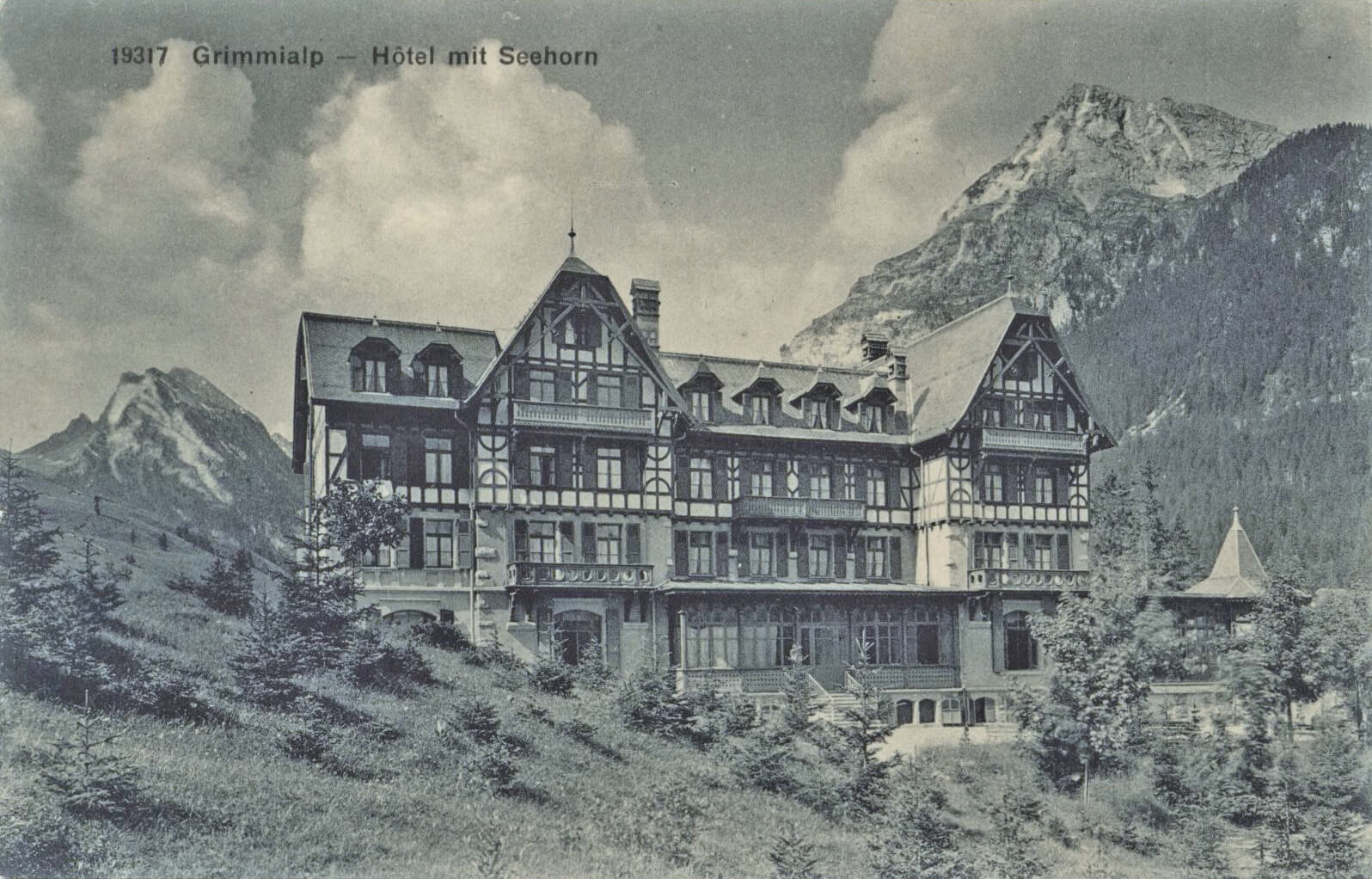 Grimmialp in Switzerland: an old black and white photo of a large building.