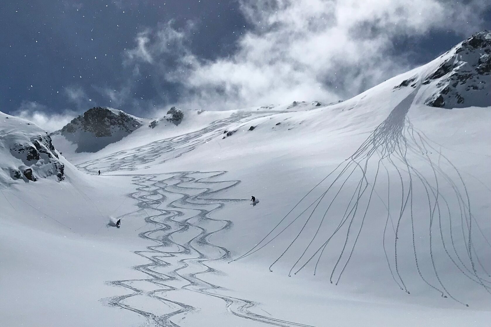 Grimmialp in Switzerland - a person skiing down a snow covered mountain.