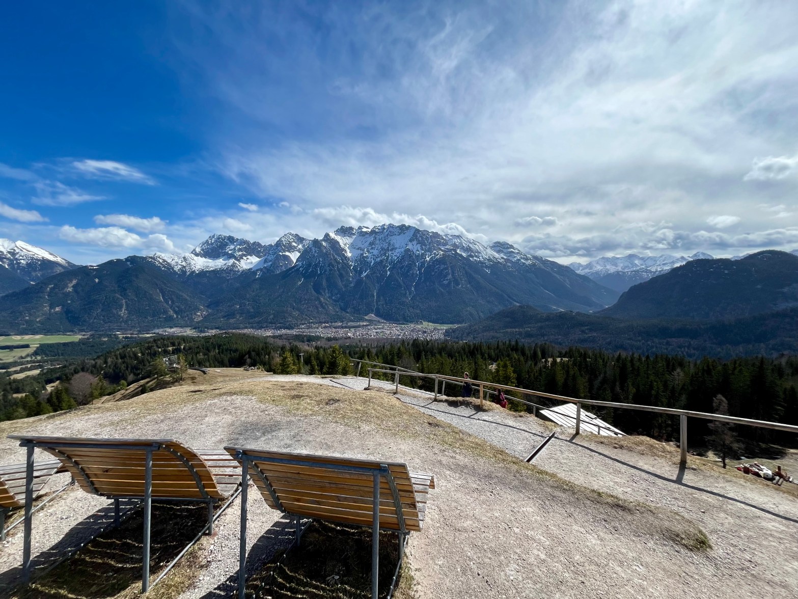 Kranzberg in Germany - two wooden benches sitting on top of a mountain.