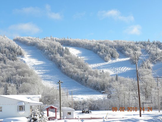 Image of Mont-Saint-Mathieu ski resort in Quebec Canada featuring a beautiful winter sports scene with ski lifts embedded in a stunning winter scenery.