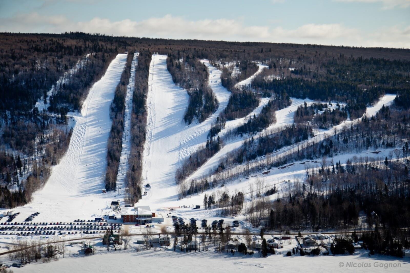 Mont-Saint-Mathieu in Canada - a ski slope covered in snow and trees.