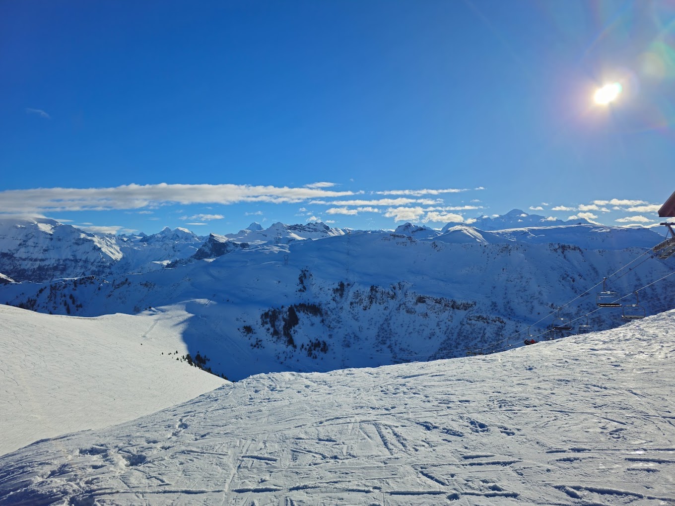 Le Grand Massif in France - the sun is shining over the snow covered mountains.