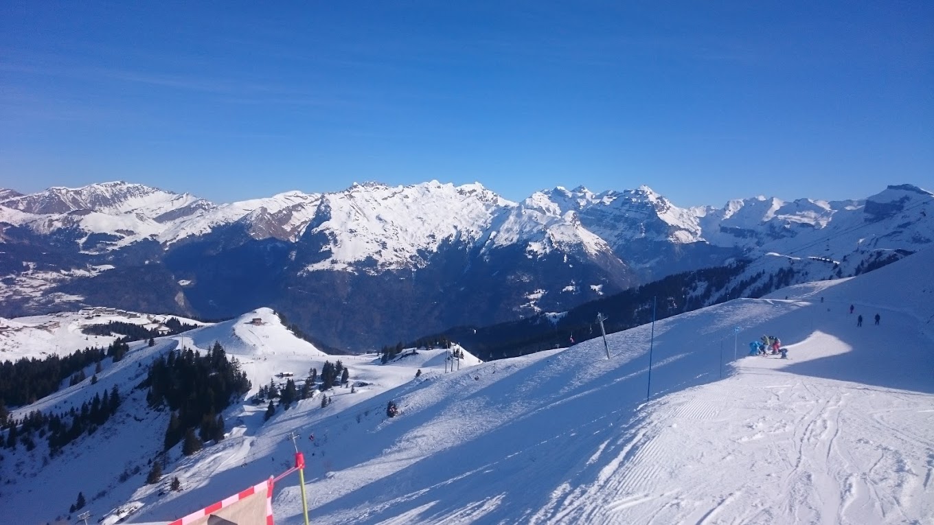 Le Grand Massif in France - a view from the top of a snowy mountain.