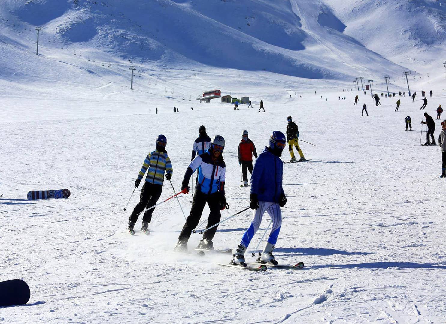 Abalı Kayak Merkezi in Turkey - a group of people skiing down a snowy hill.