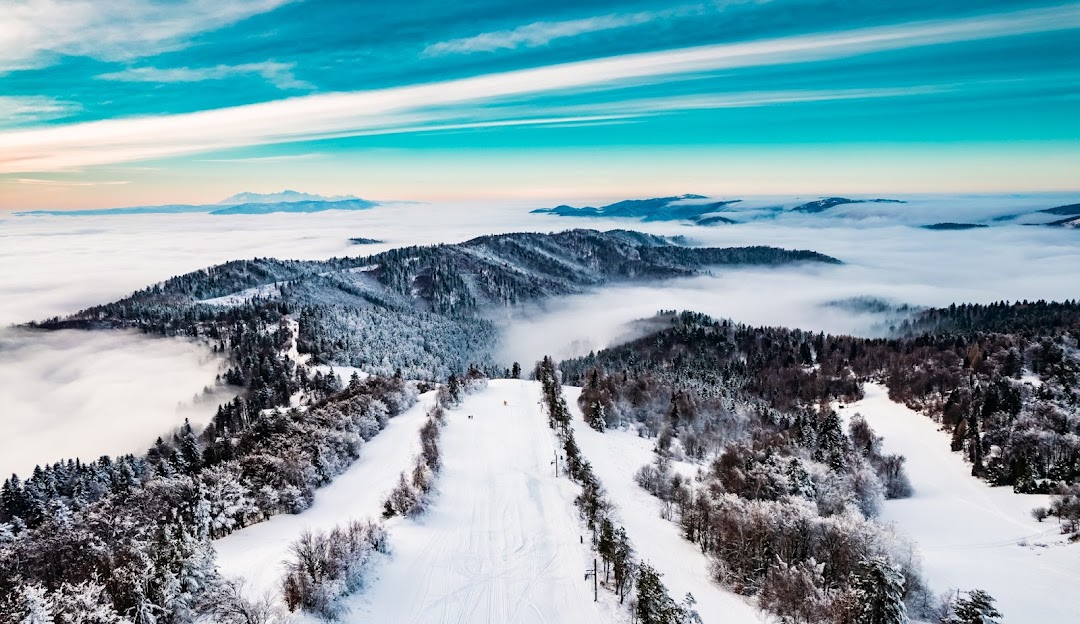 A winter sports scene at Lysá in Drienica Slovakia featuring a ski resort amidst a breathtaking winter scenery. Ski lifts can be seen against the stunning backdrop completing the idyllic winter wonderland.