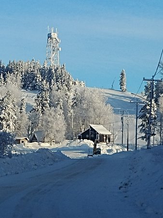 A beautiful winter scene at Mount Jamieson in Northern Ontario Canada showing a thriving winter sports centre and a ski resort amidst stunning snow-covered scenery.
