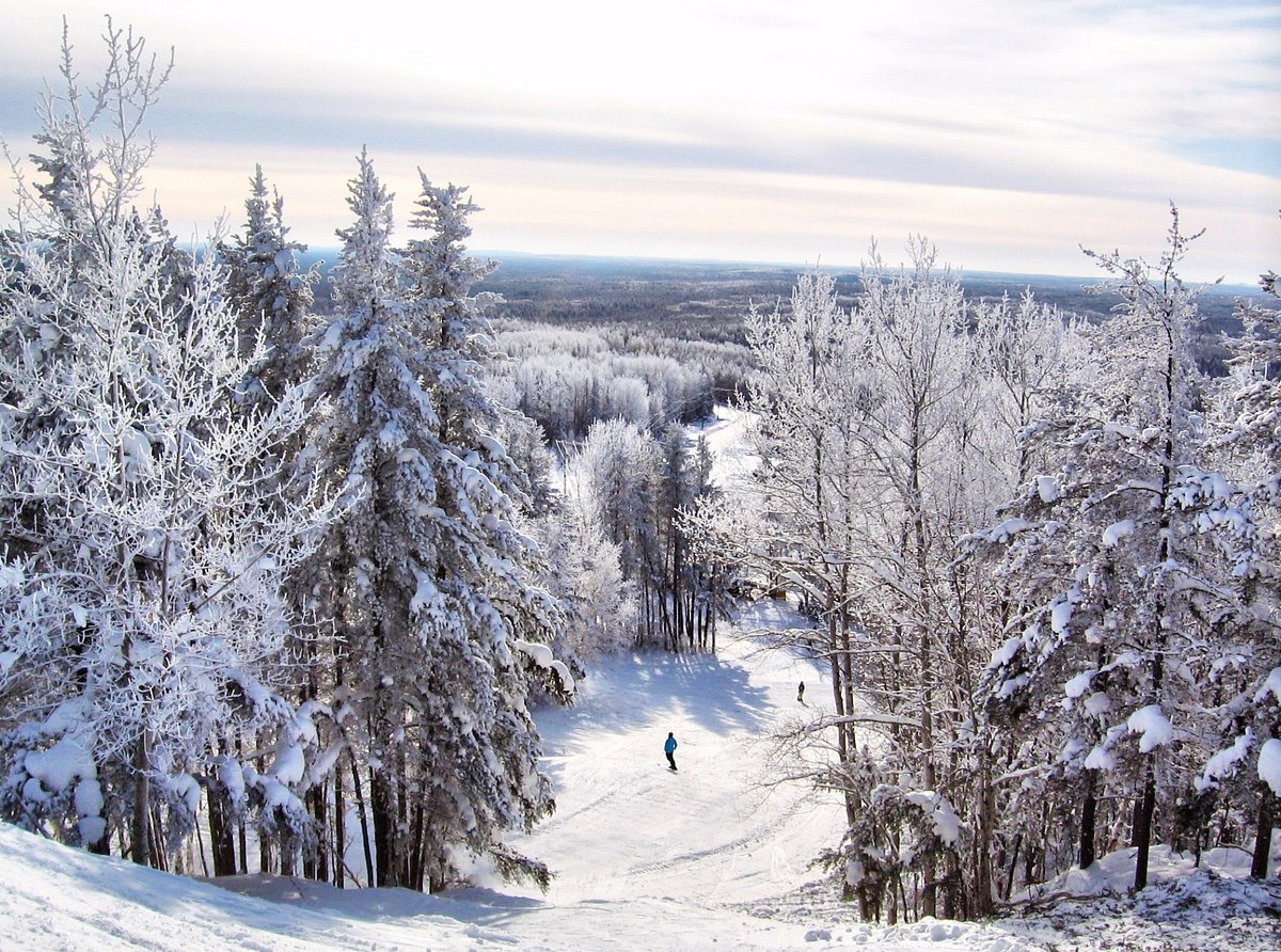 Mount Jamieson in Canada - a person walking down a snow covered trail.