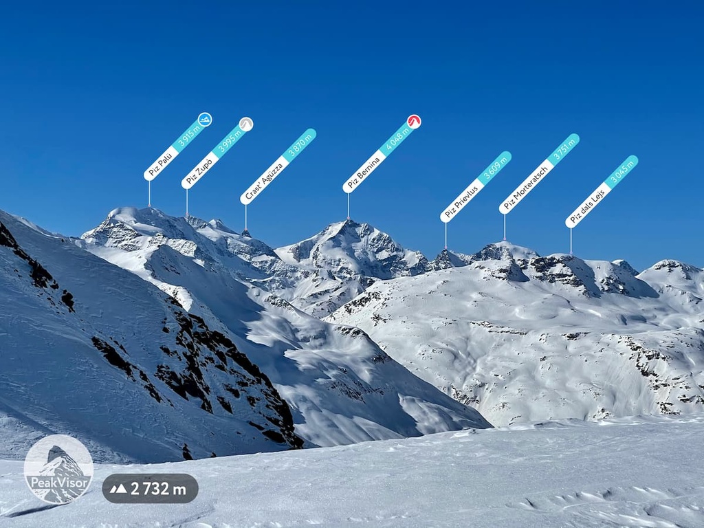 Alpe Teglio in Italy - a snow covered mountain with several signs on it.