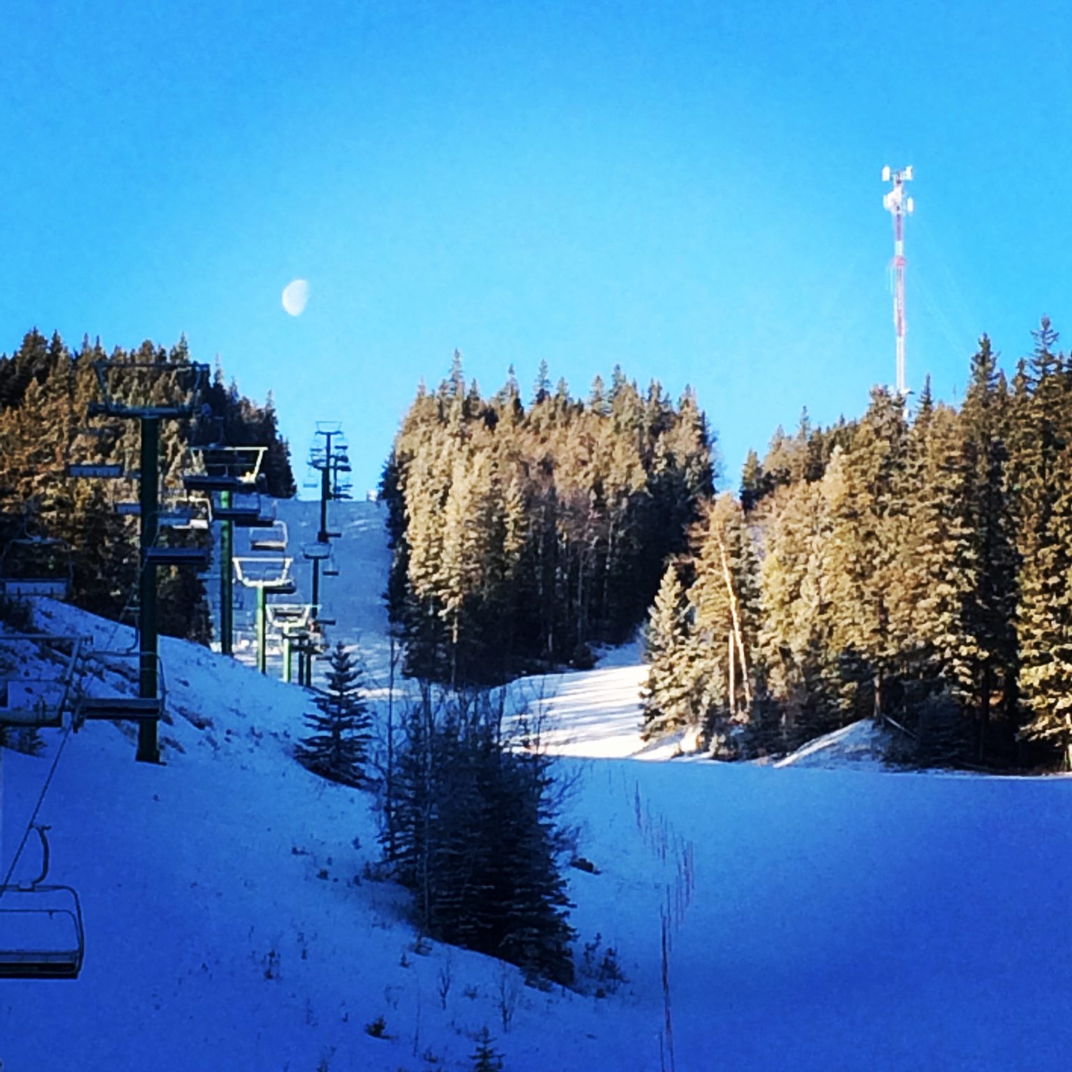Hidden Valley in Canada - a ski lift going up a snowy hill.