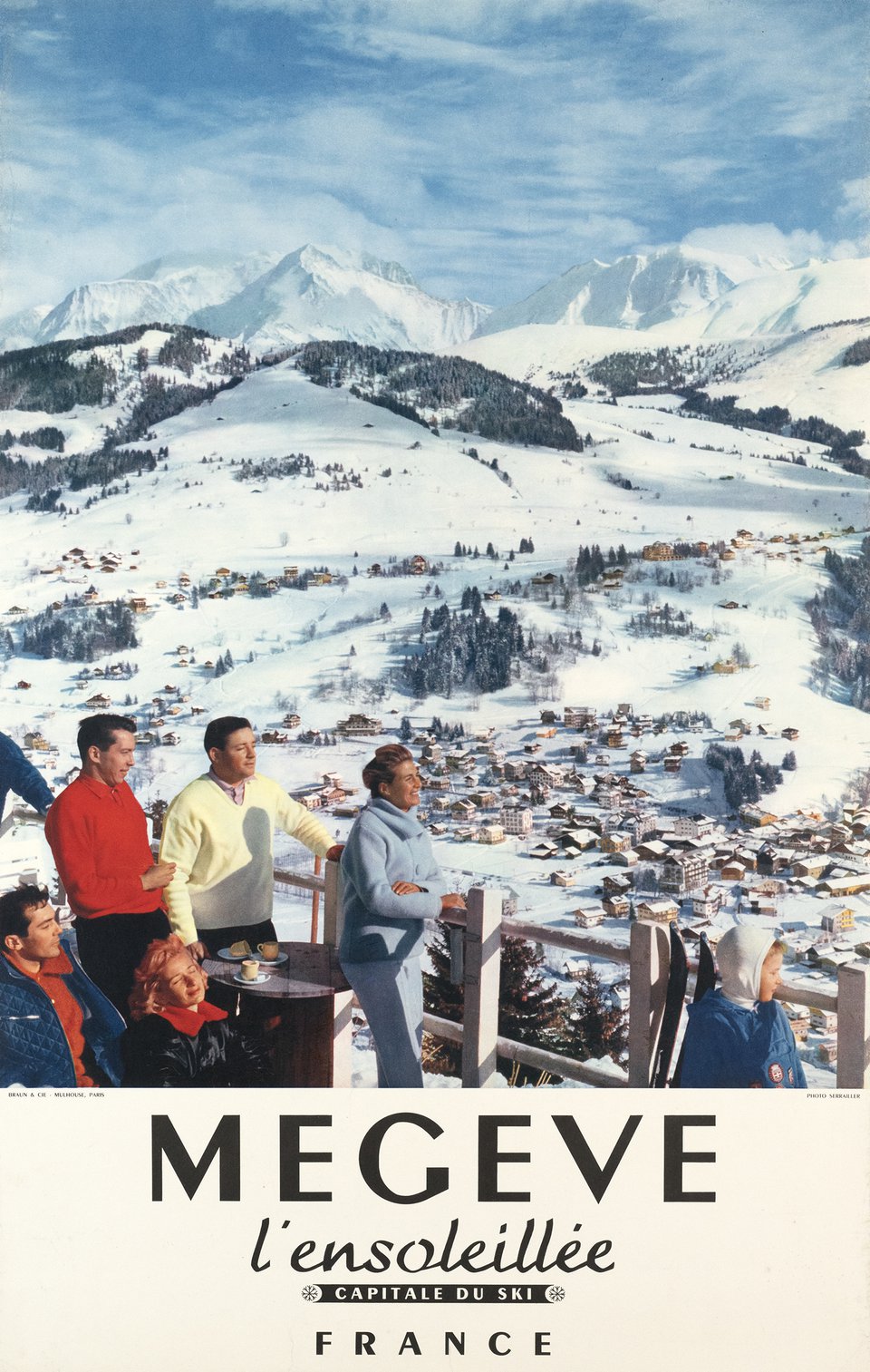Megève in France - a group of people sitting on top of a mountain.