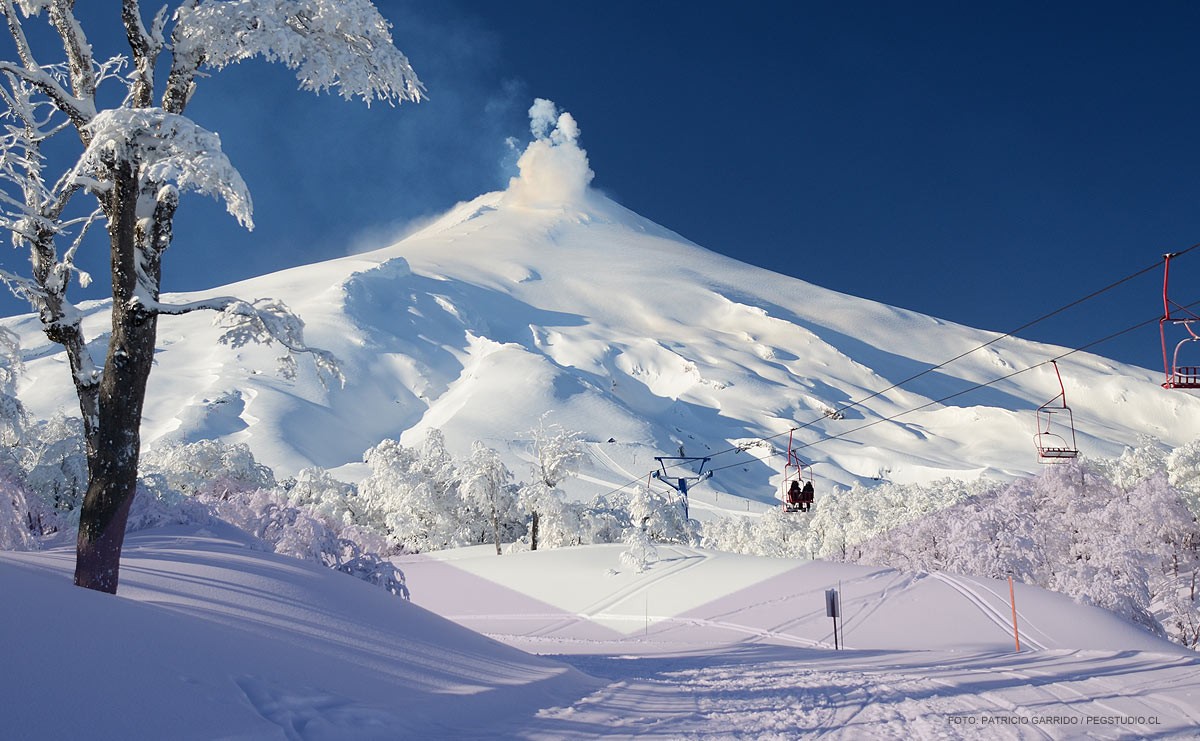 Volcan Villarrica Ski Center in Chile - a ski lift going up a snowy mountain.
