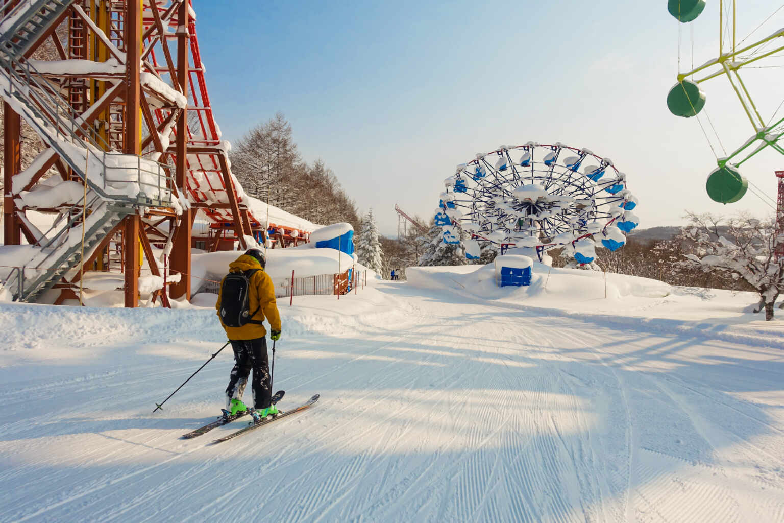 Rusutsu in Japan - a person on skis going down a hill.