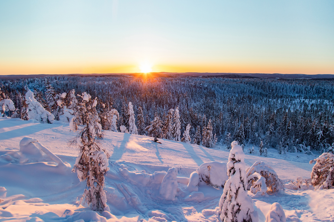 Säfsen in Sweden - the sun is setting over a snowy landscape.