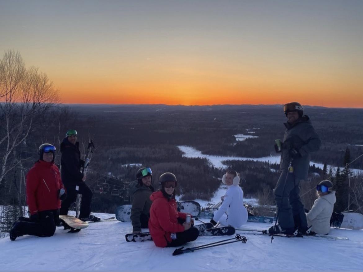 Mt Baldy Thunder Bay in Canada - a group of people sitting on top of a mountain.